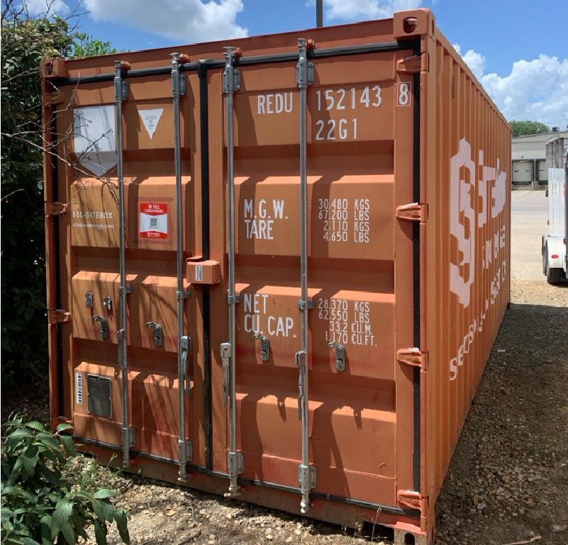 Used SiteBox shipping container showing typical dents, scratches and exterior wear.
