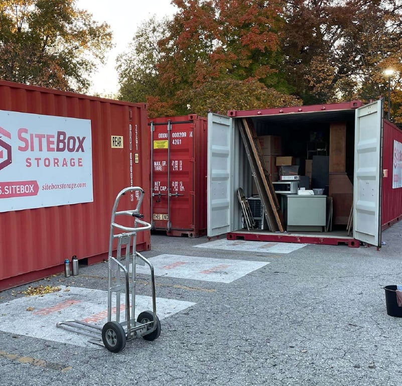 Open SiteBox Storage container organized with tools and materials for efficient jobsite storage on a construction project.