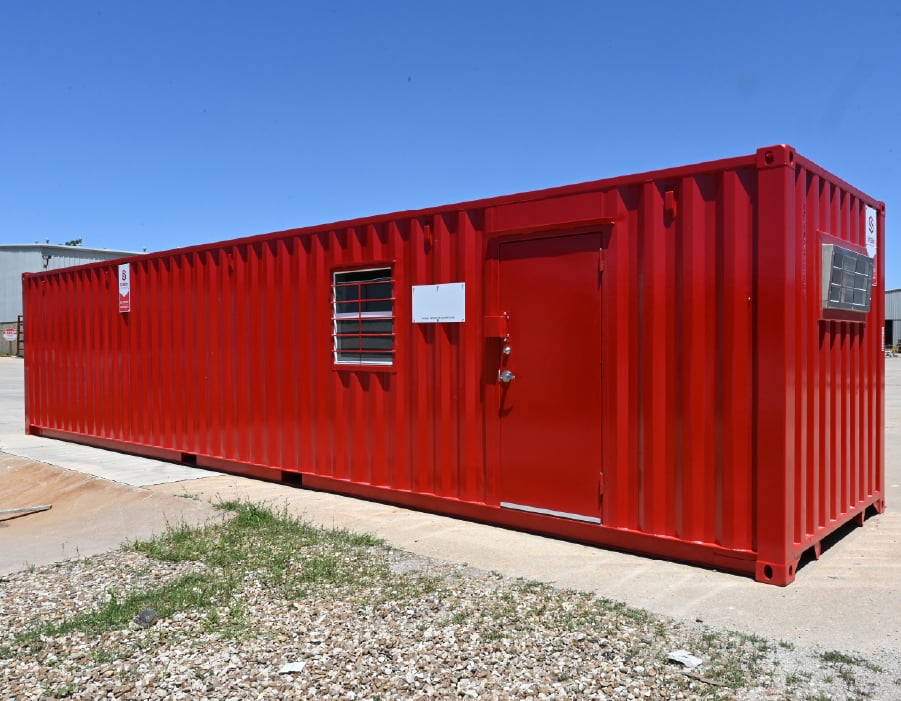 Red portable mobile office building exterior on a construction site.